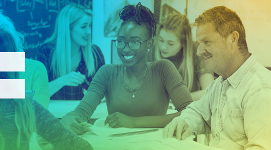 A group of educators sitting at a table.