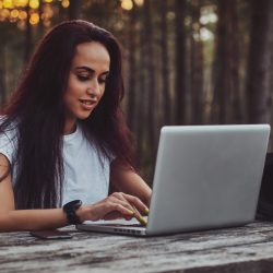 cheerful-student-is-working-on-the-laptop-in-the-m-2021-08-28-02-48-22-utc